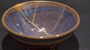 Kintsugi - Broken pottery bowl repaired with gold